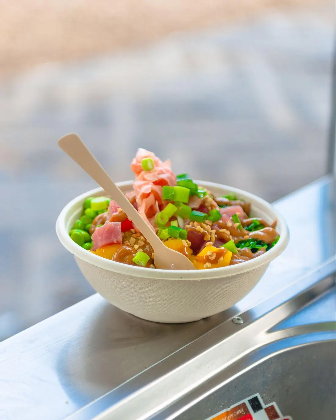 A Peeld poke bowl with a wooden fork